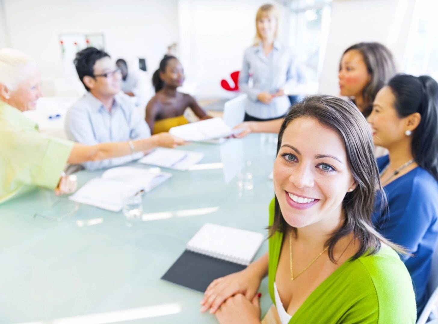 A group of people sitting around a table.