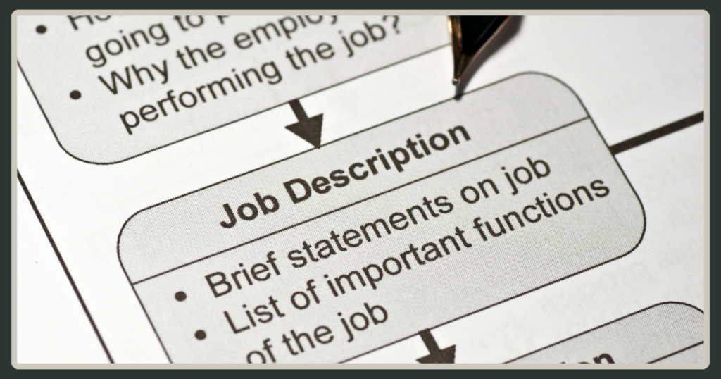 A close-up shot of a printed "Job Description" document with bullet points detailing job statements and important functions.